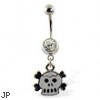 Belly ring with dangling cartoon skull and crossbones