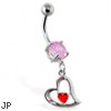 Navel ring with dangling red jeweled heart