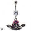 Navel ring with dangling skull with bandana on bike