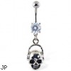 Navel ring with dangling skull with headphones